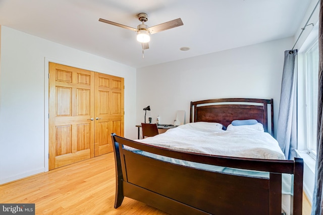 bedroom featuring a closet, ceiling fan, and wood finished floors