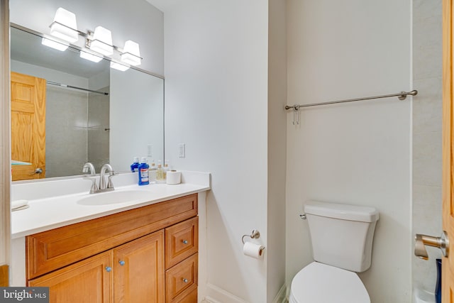 full bathroom featuring vanity and toilet