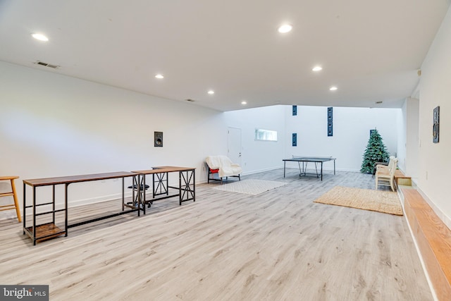 interior space featuring light wood-style flooring, visible vents, and recessed lighting