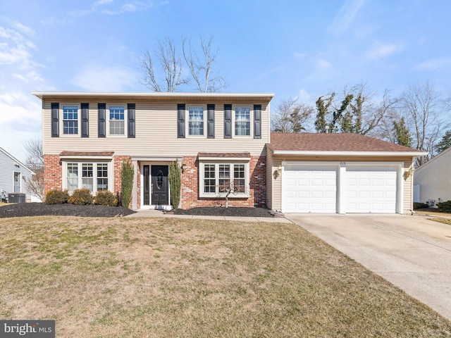 view of front of home with driveway, brick siding, a front lawn, and an attached garage