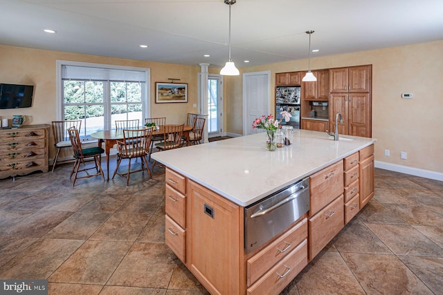 kitchen featuring recessed lighting, a sink, baseboards, hanging light fixtures, and a warming drawer