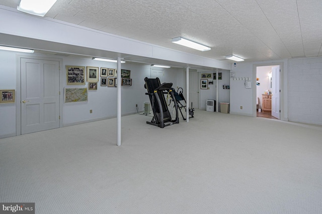 workout room with carpet and a textured ceiling