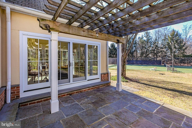 view of patio / terrace featuring fence and a pergola