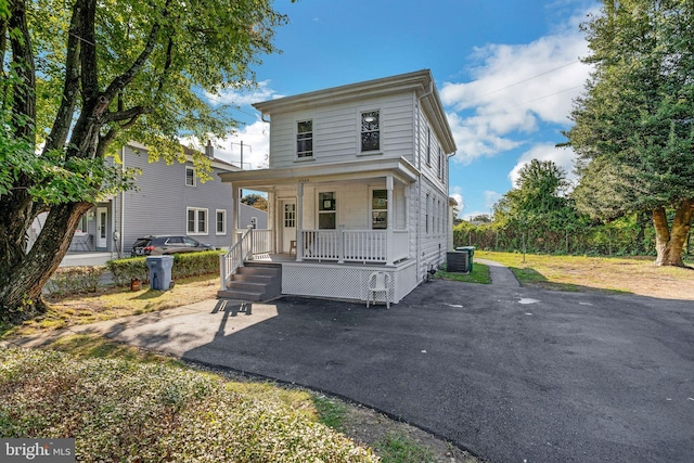 view of front of home with central AC and covered porch