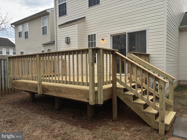 wooden deck featuring a wall mounted AC