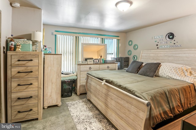 bedroom featuring light colored carpet