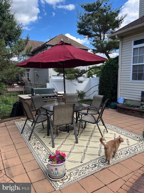 view of patio with a grill