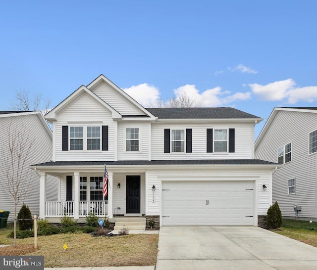 traditional-style house featuring concrete driveway, a porch, and an attached garage