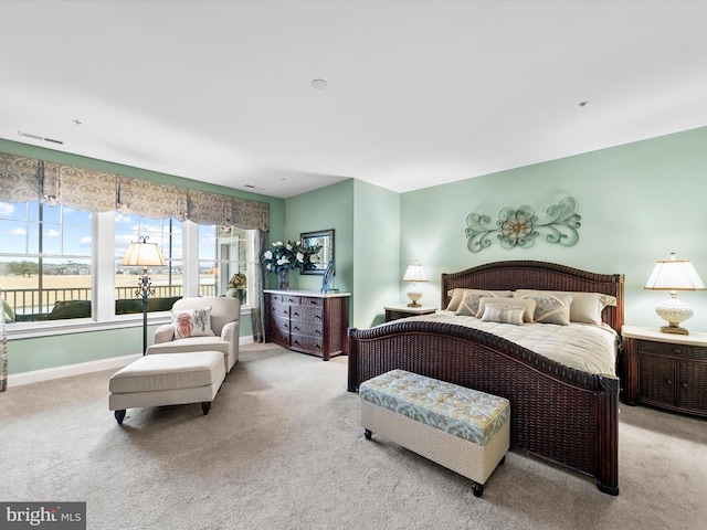 bedroom with light colored carpet