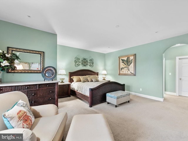 bedroom featuring light colored carpet