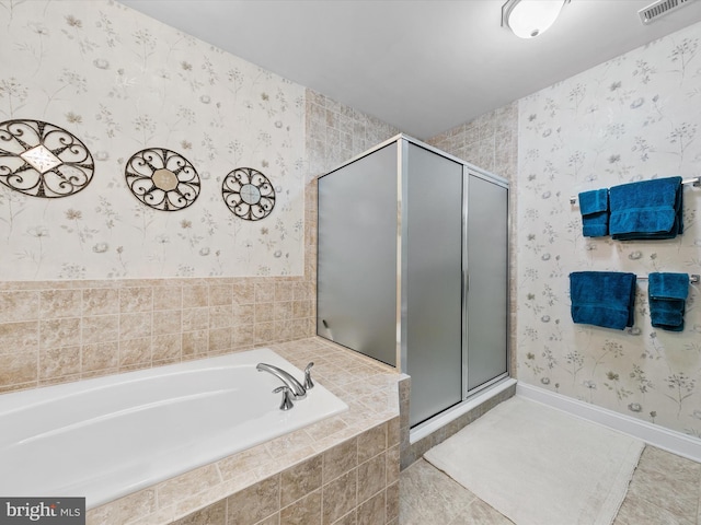 bathroom featuring independent shower and bath and tile patterned flooring