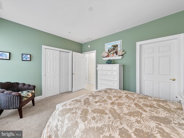 bedroom with light carpet and a closet