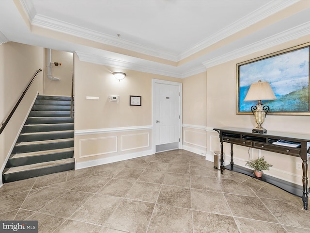 entrance foyer featuring ornamental molding