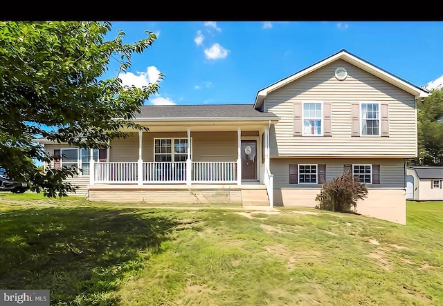 split level home featuring a front yard and covered porch