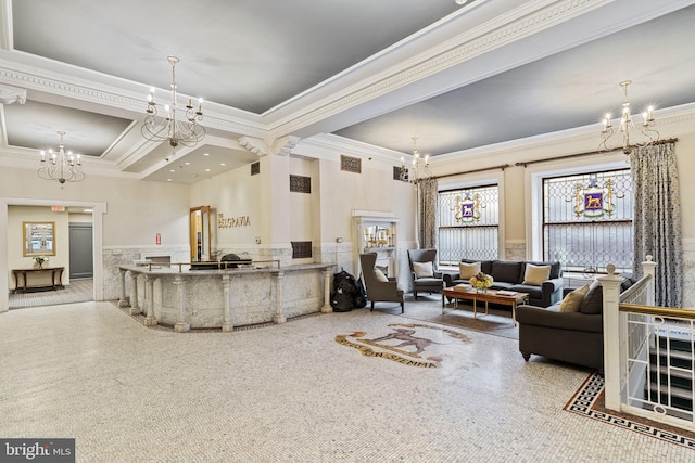 living room featuring crown molding, a raised ceiling, and an inviting chandelier