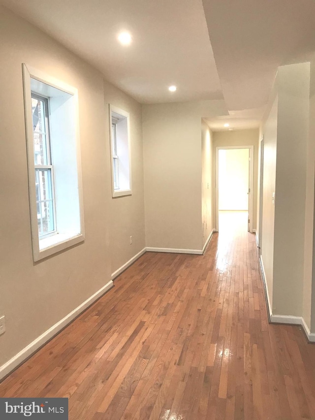 corridor featuring wood-type flooring