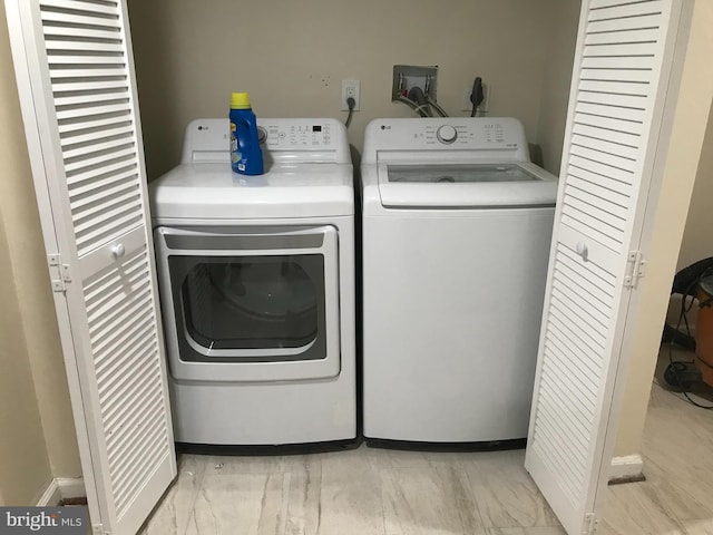 laundry room with independent washer and dryer