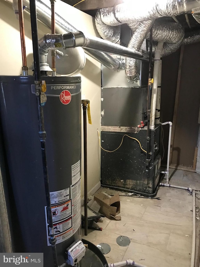 utility room featuring gas water heater