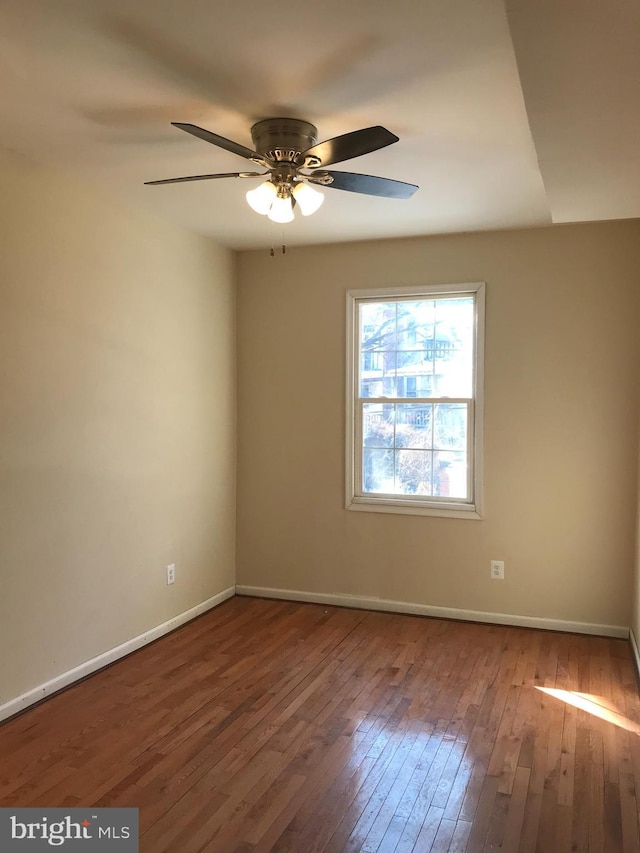 empty room with wood-type flooring and ceiling fan