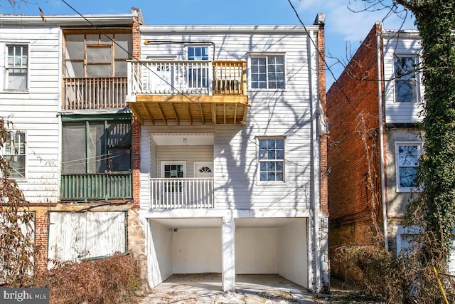 rear view of house featuring a balcony