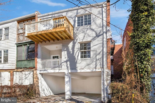 back of house with a balcony