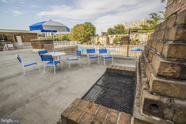 view of patio / terrace featuring fence