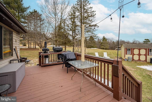 wooden terrace featuring a yard and a shed