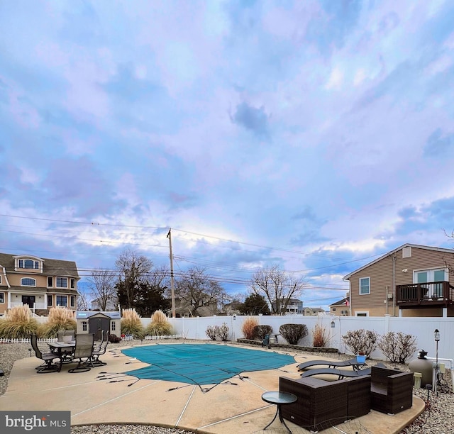 view of swimming pool with a patio area