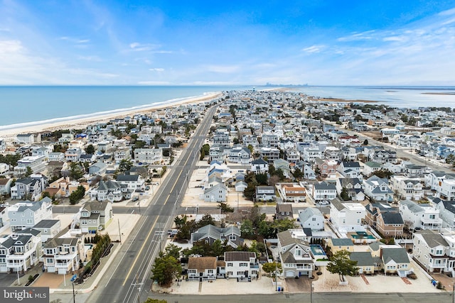 aerial view featuring a water view and a view of the beach