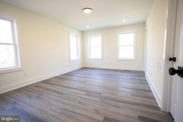 spare room featuring dark wood-type flooring