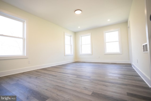 empty room featuring dark wood-type flooring