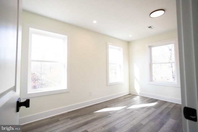 unfurnished room featuring dark hardwood / wood-style floors