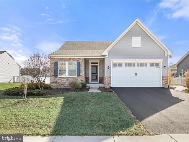 view of front of house with a garage and a front lawn