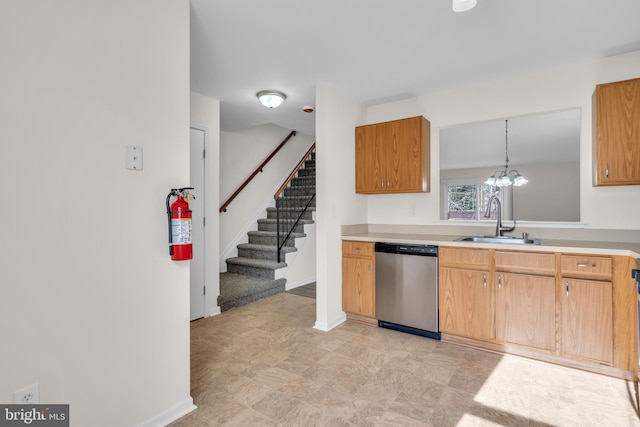 kitchen with dishwasher, sink, and pendant lighting