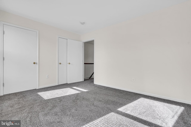 unfurnished bedroom with carpet flooring