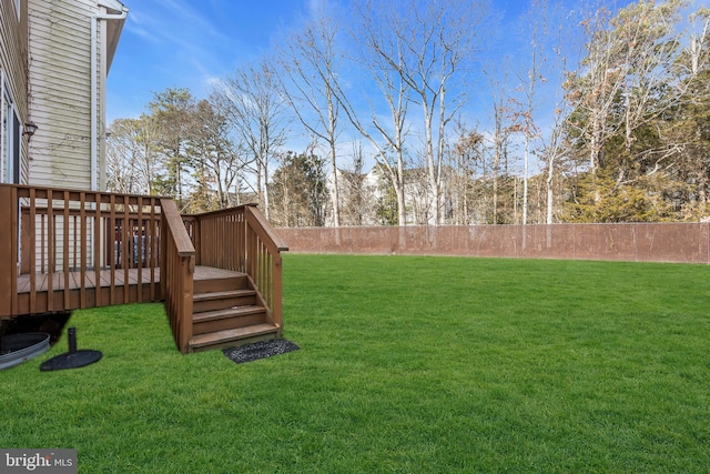 view of yard with a wooden deck