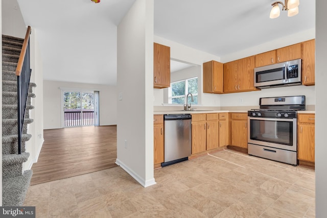 kitchen with sink and appliances with stainless steel finishes