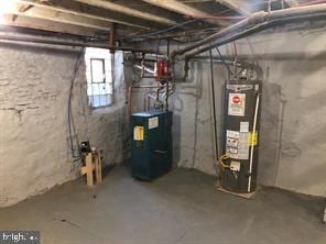 utilities with gas water heater and water heater