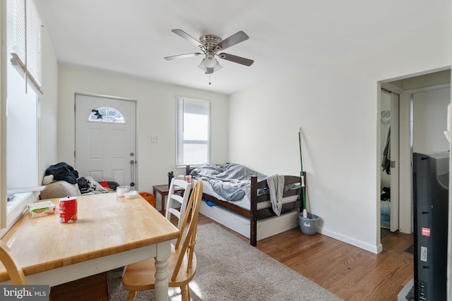 interior space with dark wood-type flooring and ceiling fan