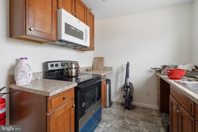 kitchen featuring sink and stainless steel electric range