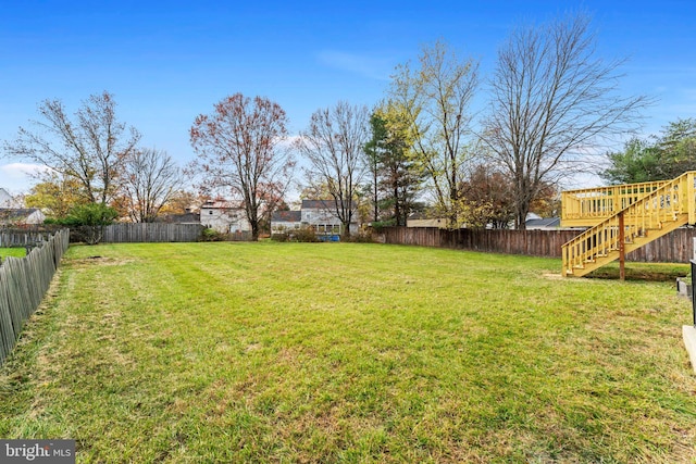 view of yard with a wooden deck