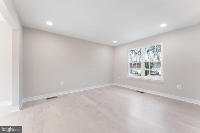 spare room featuring light wood-type flooring