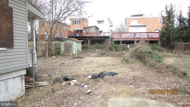 view of yard with a deck and a shed