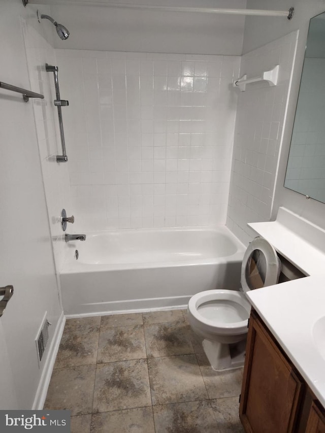 full bathroom featuring vanity, toilet, and tiled shower / bath