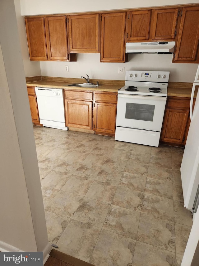 kitchen with sink and white appliances