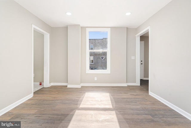 unfurnished room featuring hardwood / wood-style floors