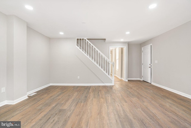 empty room with hardwood / wood-style floors