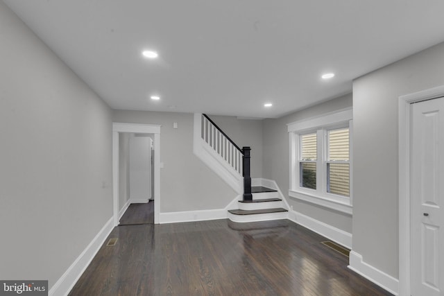 foyer featuring dark wood-type flooring