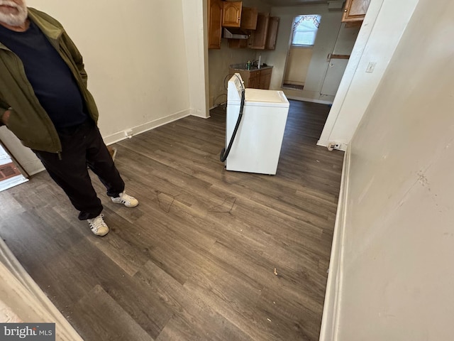 interior details featuring hardwood / wood-style flooring and fridge