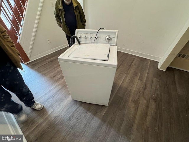 laundry area featuring washer / clothes dryer and dark hardwood / wood-style flooring